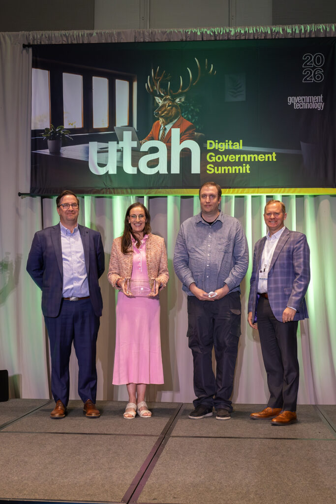 Utah County AI-Driven Storm Drain Detection for Mosquito Abatement team members on stage receiving award.